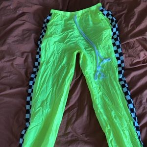 Neon green puffy festival pants w checkers